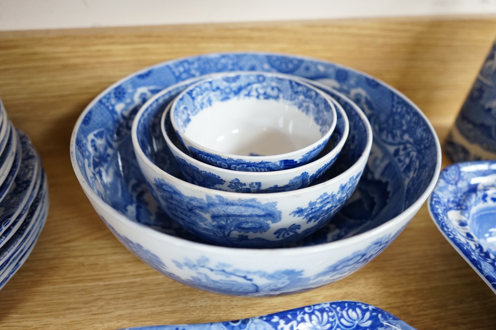 A Spode blue and white Italian service to include dinner plates, graduated bowls and platters, largest 37cm wide